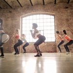 group of women doing exercise inside the building