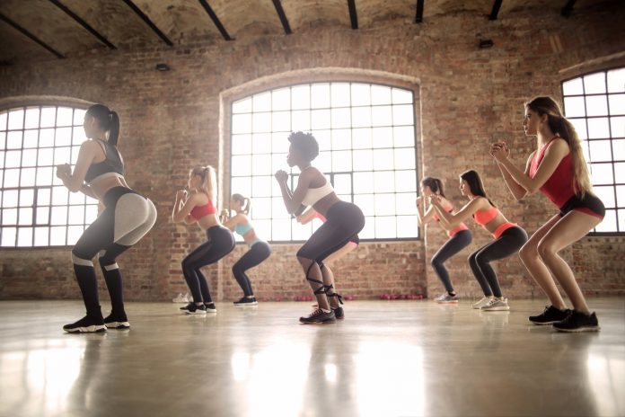 group of women doing exercise inside the building